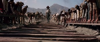 Movie still from “Once Upon a Time in the West” (1968), directed by Sergio Leone – Wide shot, Low angle