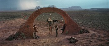 Movie still from “Once Upon a Time in the West” (1968), directed by Sergio Leone – Wide shot, Low angle