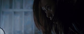 Movie still from “The Expendables 2” (2012), directed by Simon West – A person with long hair; Close Up shot, Low angle