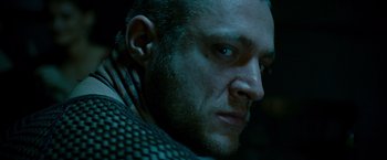 Movie still from “The Expendables 2” (2012), directed by Simon West – A person with a beard; Close Up shot, Low angle