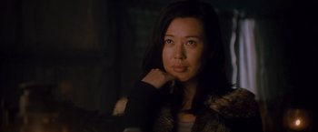 Movie still from “The Expendables 2” (2012), directed by Simon West – A person sitting in front of a window; Close Up shot, Low angle