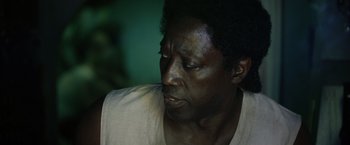 Movie still from “The Expendables 3” (2014), directed by Patrick Hughes – A person looking down; Close Up shot, Over the shoulder angle