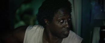 Movie still from “The Expendables 3” (2014), directed by Patrick Hughes – An older black man looking at something in the distance; Close Up shot, High angle