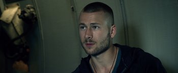 Movie still from “The Expendables 3” (2014), directed by Patrick Hughes – A person with a beard; Close Up shot, Over the shoulder angle