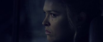 Movie still from “The Expendables 3” (2014), directed by Patrick Hughes – A woman's face in the dark; Close Up shot, Low angle