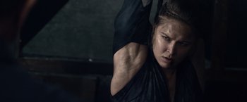 Movie still from “The Expendables 3” (2014), directed by Patrick Hughes – A person stretching her arms; Close Up shot, Low angle