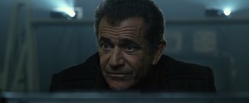 Movie still from “The Expendables 3” (2014), directed by Patrick Hughes – A person looking at the camera; Close Up shot, Over the shoulder angle