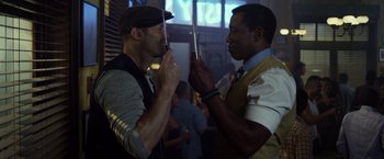 Movie still from “The Expendables 3” (2014), directed by Patrick Hughes – Two men talking to each other in a room; Close Up shot, Over the shoulder angle