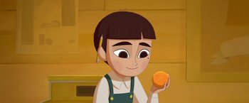 Movie still from “My Father's Dragon” (2022), directed by Nora Twomey – An animated girl holding an orange in her hand; Close Up shot, Low angle