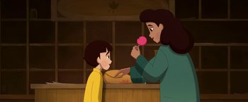 Movie still from “My Father's Dragon” (2022), directed by Nora Twomey – An animated woman holding a lollipop next to a child; Medium shot, High angle
