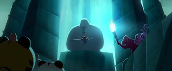 Movie still from “My Father's Dragon” (2022), directed by Nora Twomey – A man is sitting on a chair in the middle of a room; Wide shot, Low angle