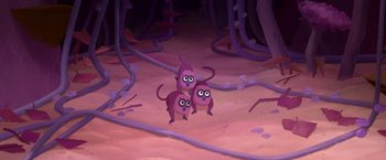 Movie still from “My Father's Dragon” (2022), directed by Nora Twomey – Three purple monkeys in the middle of a forest; Extreme Wide shot, High angle