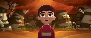 Movie still from “My Father's Dragon” (2022), directed by Nora Twomey – An animated boy is looking at the camera; Medium shot, High angle