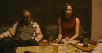 Movie still from “The Forest of Love” (2019), directed by Sion Sono – A man and a woman sitting at a table with drinks; Medium shot, High angle