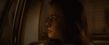 Movie still from “The Glass Castle” (2017), directed by Destin Daniel Cretton – A person's face in the dark; Close Up shot, Low angle