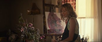 Movie still from “The Glass Castle” (2017), directed by Destin Daniel Cretton – A woman is painting a picture of flowers; Medium shot, Over the shoulder angle