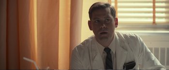 Movie still from “The Glass Castle” (2017), directed by Destin Daniel Cretton – A man wearing a white shirt and a black tie; Close Up shot, Low angle