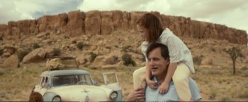 Movie still from “The Glass Castle” (2017), directed by Destin Daniel Cretton – A man and a little girl sitting on his shoulders; Medium shot, Over the shoulder angle