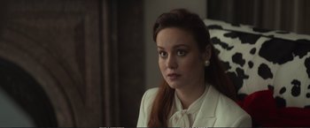 Movie still from “The Glass Castle” (2017), directed by Destin Daniel Cretton – A woman in a white shirt and a white bow tie; Close Up shot, Over the shoulder angle