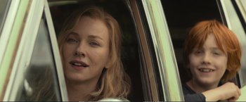 Movie still from “The Glass Castle” (2017), directed by Destin Daniel Cretton – A person sitting in a car; Close Up shot, Over the shoulder angle
