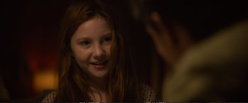 Movie still from “The Glass Castle” (2017), directed by Destin Daniel Cretton – A young girl is smiling in front of a mirror; Close Up shot, Over the shoulder angle