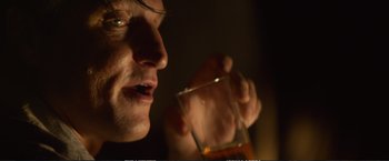 Movie still from “The Glass Castle” (2017), directed by Destin Daniel Cretton – A person holding a glass of wine; Extreme Close Up shot, Over the shoulder angle