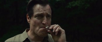 Movie still from “The Glass Castle” (2017), directed by Destin Daniel Cretton – A person smoking a cigarette; Close Up shot, Low angle