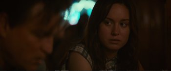 Movie still from “The Glass Castle” (2017), directed by Destin Daniel Cretton – A woman with long brown hair is looking at the camera; Close Up shot, Over the shoulder angle