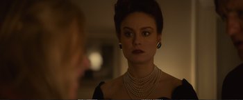 Movie still from “The Glass Castle” (2017), directed by Destin Daniel Cretton – A woman in a black dress looking into a mirror; Close Up shot, Over the shoulder angle