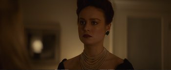 Movie still from “The Glass Castle” (2017), directed by Destin Daniel Cretton – A person wearing a necklace; Close Up shot, Over the shoulder angle