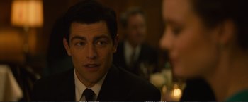 Movie still from “The Glass Castle” (2017), directed by Destin Daniel Cretton – A man in a suit and tie sitting in front of a table; Close Up shot, Over the shoulder angle