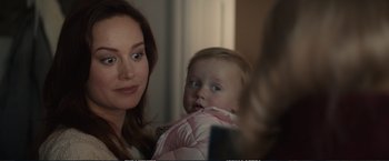 Movie still from “The Glass Castle” (2017), directed by Destin Daniel Cretton – A woman and a baby looking at a mirror; Close Up shot, Over the shoulder angle