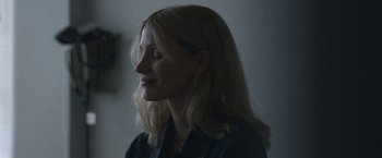 Movie still from “The Good Nurse” (2022), directed by Tobias Lindholm – A woman with long blonde hair wearing a black shirt; Close Up shot, Low angle