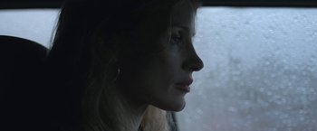 Movie still from “The Good Nurse” (2022), directed by Tobias Lindholm – A person looking out of a car window; Close Up shot, Low angle