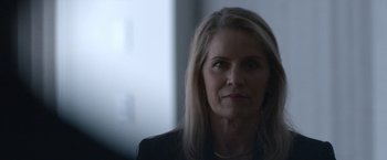 Movie still from “The Good Nurse” (2022), directed by Tobias Lindholm – A person with long hair; Close Up shot, Over the shoulder angle