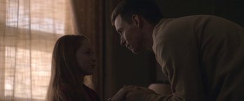 Movie still from “The Good Nurse” (2022), directed by Tobias Lindholm – A man and a woman holding each other's hands; Close Up shot, Over the shoulder angle