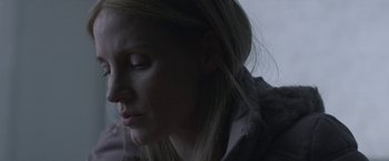 Movie still from “The Good Nurse” (2022), directed by Tobias Lindholm – A person with her eyes closed; Close Up shot, Over the shoulder angle