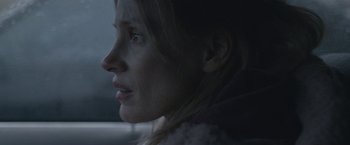 Movie still from “The Good Nurse” (2022), directed by Tobias Lindholm – A person in a car looking out the window; Close Up shot, Over the shoulder angle