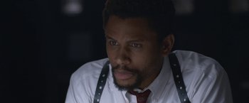 Movie still from “The Good Nurse” (2022), directed by Tobias Lindholm – A person wearing a shirt and a tie; Close Up shot, Over the shoulder angle