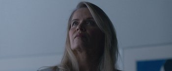 Movie still from “The Good Nurse” (2022), directed by Tobias Lindholm – A person with long blonde hair; Close Up shot, Low angle