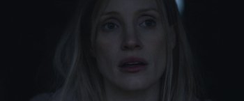 Movie still from “The Good Nurse” (2022), directed by Tobias Lindholm – A woman's face in the dark; Close Up shot, Low angle