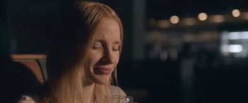 Movie still from “The Good Nurse” (2022), directed by Tobias Lindholm – A woman with her eyes closed holding a glass of water; Close Up shot, Over the shoulder angle