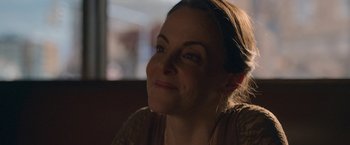 Movie still from “The Good Nurse” (2022), directed by Tobias Lindholm – A person sitting in front of a window; Close Up shot, Over the shoulder angle