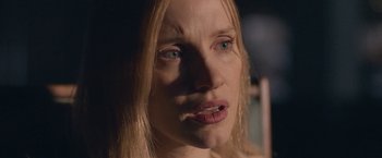 Movie still from “The Good Nurse” (2022), directed by Tobias Lindholm – A person with long hair; Close Up shot, Over the shoulder angle
