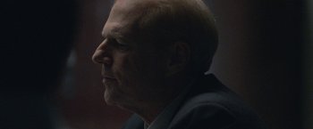 Movie still from “The Good Nurse” (2022), directed by Tobias Lindholm – A man's head and shoulders; Close Up shot, Low angle