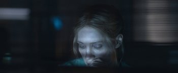 Movie still from “The Good Nurse” (2022), directed by Tobias Lindholm – A woman with her eyes closed in a dark room; Close Up shot, Over the shoulder angle