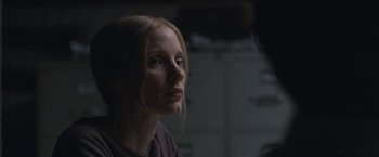 Movie still from “The Good Nurse” (2022), directed by Tobias Lindholm – A person with long blonde hair; Close Up shot, Over the shoulder angle