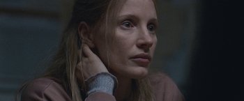 Movie still from “The Good Nurse” (2022), directed by Tobias Lindholm – A person with her hand on her head; Close Up shot, Low angle
