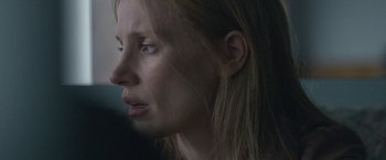 Movie still from “The Good Nurse” (2022), directed by Tobias Lindholm – A person with long hair; Close Up shot, Over the shoulder angle
