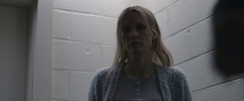 Movie still from “The Good Nurse” (2022), directed by Tobias Lindholm – A woman with long blonde hair standing in a room; Close Up shot, Low angle